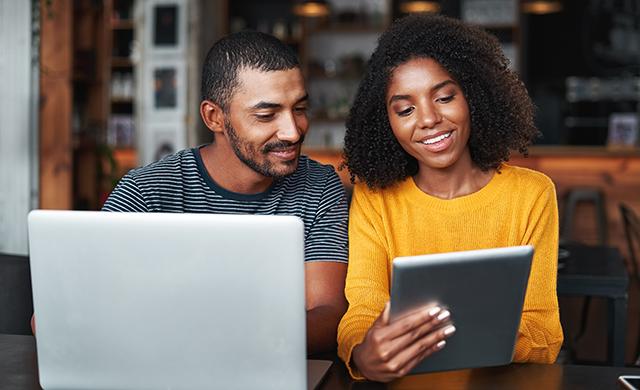 couple using laptop